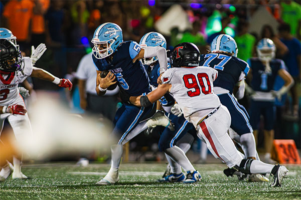 Max Nashed (#5) keeps the ball and breaks some tackles.