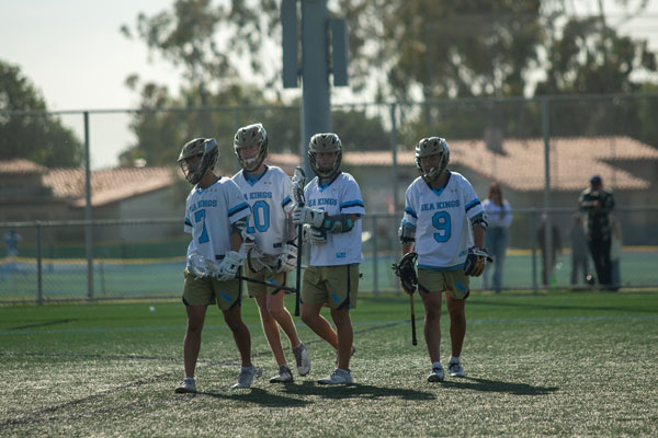 Corona del Mar’s powerful offensive leaders walking off the field after another point.