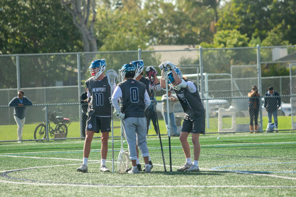 Newport Harbor’s defensemen huddled up after a play.