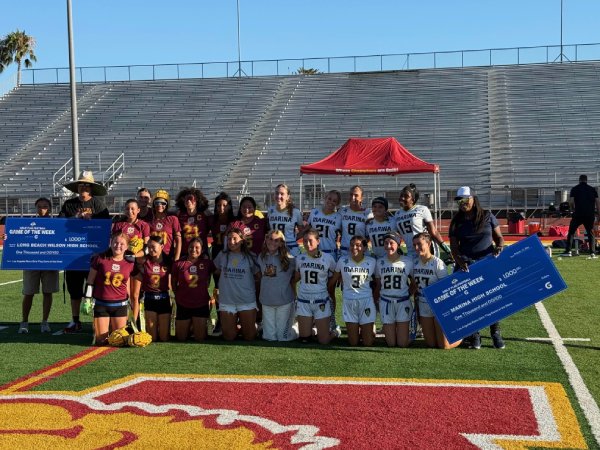 Marina girls flag football team cheque