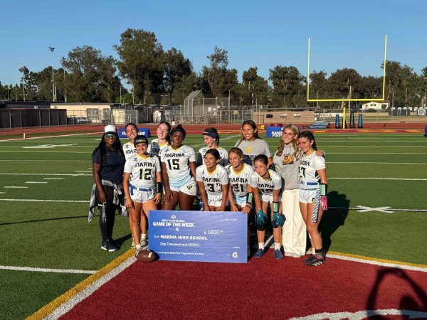 Marina girls flag football team cheque